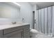 Modern bathroom with gray vanity, white marble countertop, and a tiled shower at 4067 Old Buff Rd, Hickory, NC 28602