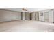 A spacious bedroom features neutral walls, plush carpeting, and a ceiling fan for added comfort at 4067 Old Buff Rd, Hickory, NC 28602