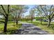 Long, tree-lined driveway leading to the residence with surrounding green landscape at 4067 Old Buff Rd, Hickory, NC 28602