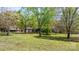 Lush green lawn and trees surrounding this charming single Gathering home at 4067 Old Buff Rd, Hickory, NC 28602