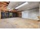Expansive unfinished garage space with exposed ceiling beams and natural light, awaiting personalization at 4067 Old Buff Rd, Hickory, NC 28602