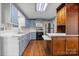 Kitchen featuring blue cabinets, a stainless steel refrigerator, and light countertops at 4067 Old Buff Rd, Hickory, NC 28602