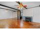 Spacious living room with hardwood floors, exposed beams, and a cozy fireplace at 4067 Old Buff Rd, Hickory, NC 28602