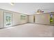 Bright and airy living room with neutral carpet, ceiling fan and natural light at 4067 Old Buff Rd, Hickory, NC 28602
