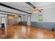 Open-concept living room with hardwood floors, beamed ceiling, and natural light at 4067 Old Buff Rd, Hickory, NC 28602