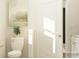 Cozy bathroom featuring white fixtures, complemented by soothing artwork and a charming green potted plant for a fresh touch at 4115 Camden Glen Rd, Lancaster, SC 29720
