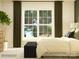Comfortable bedroom featuring a large window, plush bed, and elegant, dark-toned curtains at 4115 Camden Glen Rd, Lancaster, SC 29720
