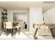Bright dining space showcasing a table and chairs, with a view into the living room and a foosball table at 4115 Camden Glen Rd, Lancaster, SC 29720