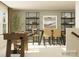 Inviting dining area with a foosball table, stylish shelving, a dining table, and woven chairs for casual gatherings at 4115 Camden Glen Rd, Lancaster, SC 29720