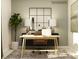 Modern home office featuring neutral tones, a stylish desk, comfortable chair, and ample natural light at 4115 Camden Glen Rd, Lancaster, SC 29720
