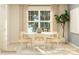 Bright dining room with a round table, light wood chairs, and a large window with natural light at 4194 Skyboat Cir, Fort Mill, SC 29715
