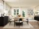 Open-concept dining area with a wooden table, upholstered chairs, and modern lighting at 4222 Skyboat Cir, Fort Mill, SC 29715