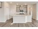 Modern kitchen featuring an island with sink, gray cabinets, white countertops, and stainless steel appliances at 4222 Skyboat Cir, Fort Mill, SC 29715