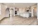 Spacious kitchen with gray cabinets, stainless appliances, island with sink, and hardwood floors at 4222 Skyboat Cir, Fort Mill, SC 29715