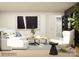 Living area showcases stylish seating, a dark accent wall, and elegant decor for modern comfort and style at 4222 Skyboat Cir, Fort Mill, SC 29715