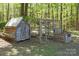 View of rustic chicken coop and fenced in area with natural surroundings at 4436 Shiloh Unity Rd, Lancaster, SC 29720