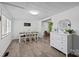 Bright dining room with stylish flooring, a white dresser, and a decorative mirror at 4436 Shiloh Unity Rd, Lancaster, SC 29720