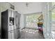 The sun room features a stainless steel refrigerator, lots of natural light and hardwood floors at 4436 Shiloh Unity Rd, Lancaster, SC 29720