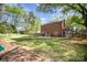 Spacious backyard featuring a brick home, a cozy patio, and a fenced yard at 45 Mckinnon Ne Ave, Concord, NC 28025