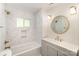This bathroom features a marble bathtub, gold fixtures, and a modern design at 45 Mckinnon Ne Ave, Concord, NC 28025