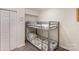 Cozy bedroom featuring a bunk bed with stylish bedding, carpeted floor and closet at 45 Mckinnon Ne Ave, Concord, NC 28025