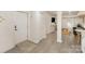 Hallway leading to open concept living room with luxury vinyl plank flooring throughout at 45 Mckinnon Ne Ave, Concord, NC 28025