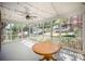 This porch has an outdoor ceiling fan, white railings, and a wooden table at 45 Mckinnon Ne Ave, Concord, NC 28025