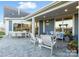 Inviting covered patio with ample seating, perfect for entertaining or relaxing outdoors at 4813 Reason Ct # 75, Harrisburg, NC 28075