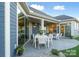 Charming back patio with an outdoor dining set and comfortable seating, ideal for relaxation at 4813 Reason Ct # 75, Harrisburg, NC 28075