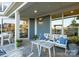 Comfortable and shaded patio space with elegant outdoor furniture and decorative accents at 4813 Reason Ct # 75, Harrisburg, NC 28075