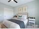 Comfortable bedroom with neutral paint, natural light, and closet storage at 4813 Reason Ct # 75, Harrisburg, NC 28075