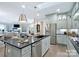 Spacious kitchen with island, stainless steel appliances, and open layout to the living area at 4813 Reason Ct # 75, Harrisburg, NC 28075