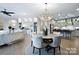 Open-concept living space with a dining area, kitchen, and stylish decor at 4813 Reason Ct # 75, Harrisburg, NC 28075