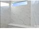 Modern shower featuring marble-like tile and a built-in bench at 4813 Reason Ct # 75, Harrisburg, NC 28075