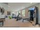 Well-equipped gym with machines, free weights, television, and padded flooring at 4825 Reason Ct # 73, Harrisburg, NC 28075