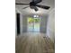 Spacious dining area with wood-look floors, a modern light fixture, and sliding glass doors to the deck at 5029 E Nc 10 Hwy Rd # 6, Catawba, NC 28609