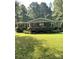Inviting home featuring a manicured lawn, front porch, and an American flag at 5029 E Nc 10 Hwy Rd # 6, Catawba, NC 28609