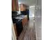 Modern kitchen with black appliances, wood cabinets, a double sink, and tile backsplash at 5029 E Nc 10 Hwy Rd # 6, Catawba, NC 28609