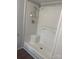 Shower stall with white tiled walls, molded seating, and hard wood flooring at 5029 E Nc 10 Hwy Rd # 6, Catawba, NC 28609