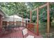 Wood deck with outdoor seating has a covered and partially shaded area for relaxing at 516 Northgate Ave, Charlotte, NC 28209