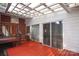 Covered wood deck with access to sliding glass doors has space for seating and entertaining at 516 Northgate Ave, Charlotte, NC 28209