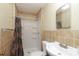 Bathroom with tiled shower and vanity with sink at 516 Northgate Ave, Charlotte, NC 28209