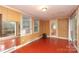 Bonus room featuring sliding glass doors and paneled walls at 516 Northgate Ave, Charlotte, NC 28209