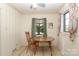 Charming dining area with wainscoting, neutral walls, and tile flooring at 516 Northgate Ave, Charlotte, NC 28209
