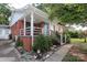 Inviting brick home with a covered porch and nicely landscaped front yard at 516 Northgate Ave, Charlotte, NC 28209