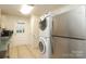 This kitchen features a washer-dryer, and stainless steel refrigerator at 516 Northgate Ave, Charlotte, NC 28209