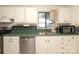Kitchen featuring white cabinets, stainless appliances and a double bowl sink at 516 Northgate Ave, Charlotte, NC 28209
