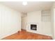 Cozy living room with a decorative fireplace and wood flooring at 516 Northgate Ave, Charlotte, NC 28209