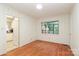 Open living room featuring hardwood floors and natural light at 516 Northgate Ave, Charlotte, NC 28209