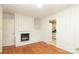 Cozy living room with a decorative fireplace and wood flooring at 516 Northgate Ave, Charlotte, NC 28209